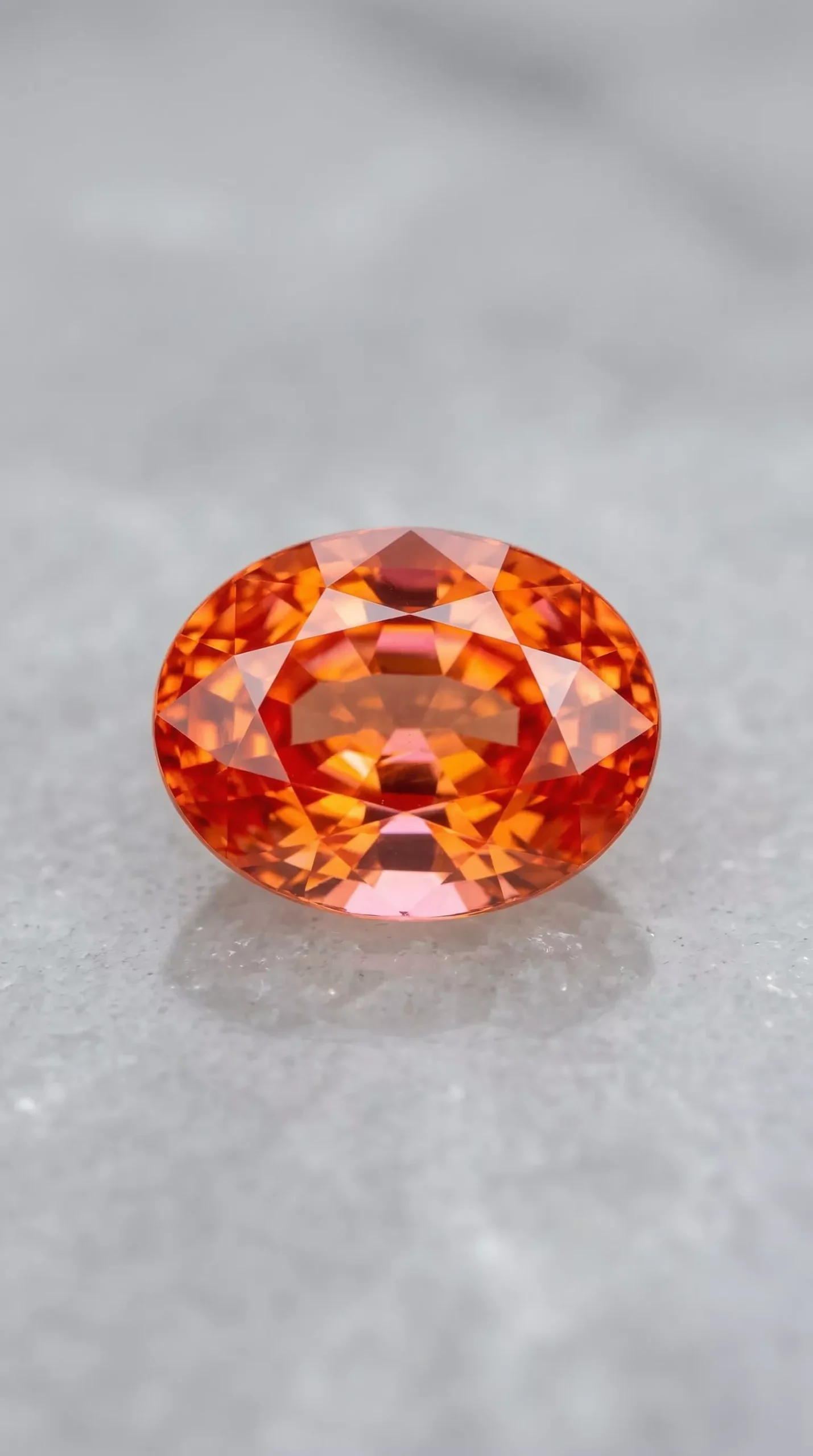 Top view of vivid orangy padparadscha sapphire oval cut 1.80 carats thumbnail